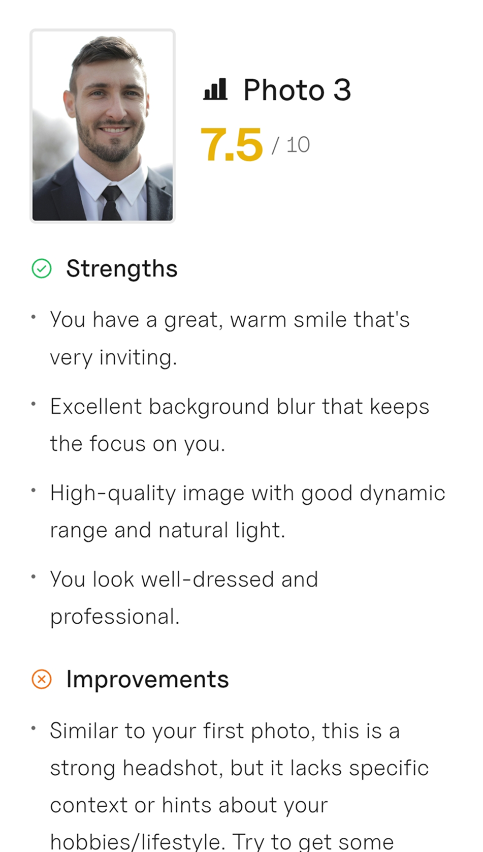 Professional headshot of a smiling man in a suit with a blurred natural background, rated 7.5 out of 10 with strengths and improvement notes.